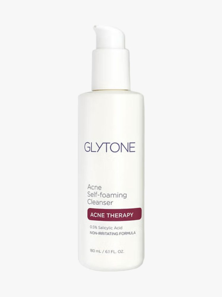 Glytone Acne Self Foaming Cleanser in branded component on a light gray background